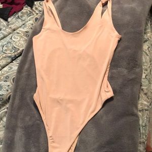 Never worn AKIRA nude spandex/polyester bodysuit
